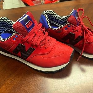 Red New Balance 574 sneakers